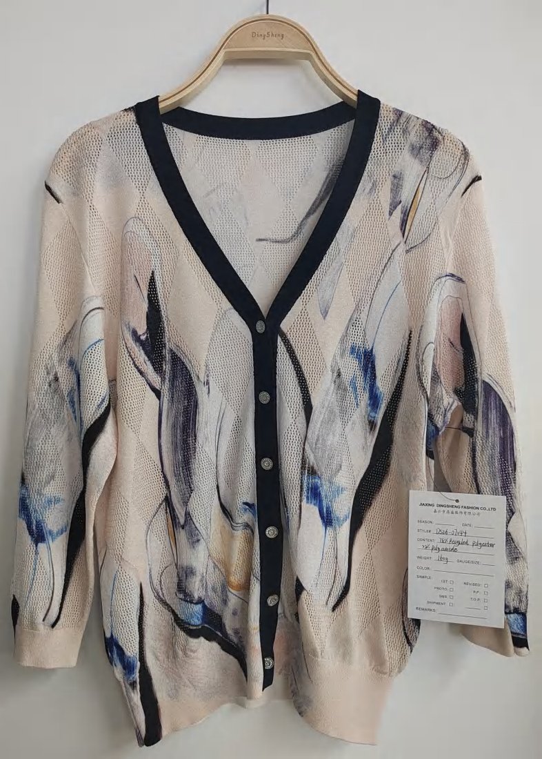 Abstract-pattern V-neck cardigan with navy trim, style DS26-07044, from the Knitwear World sample collection