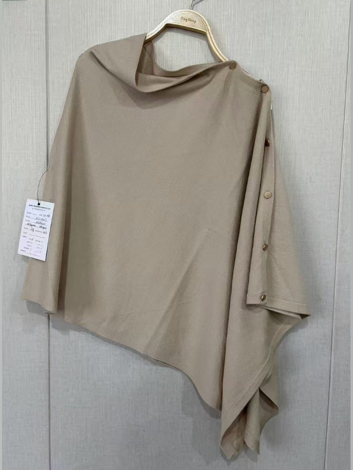 Beige asymmetric knit poncho with buttons, style DS27-09027, from the Knitwear World sample collection