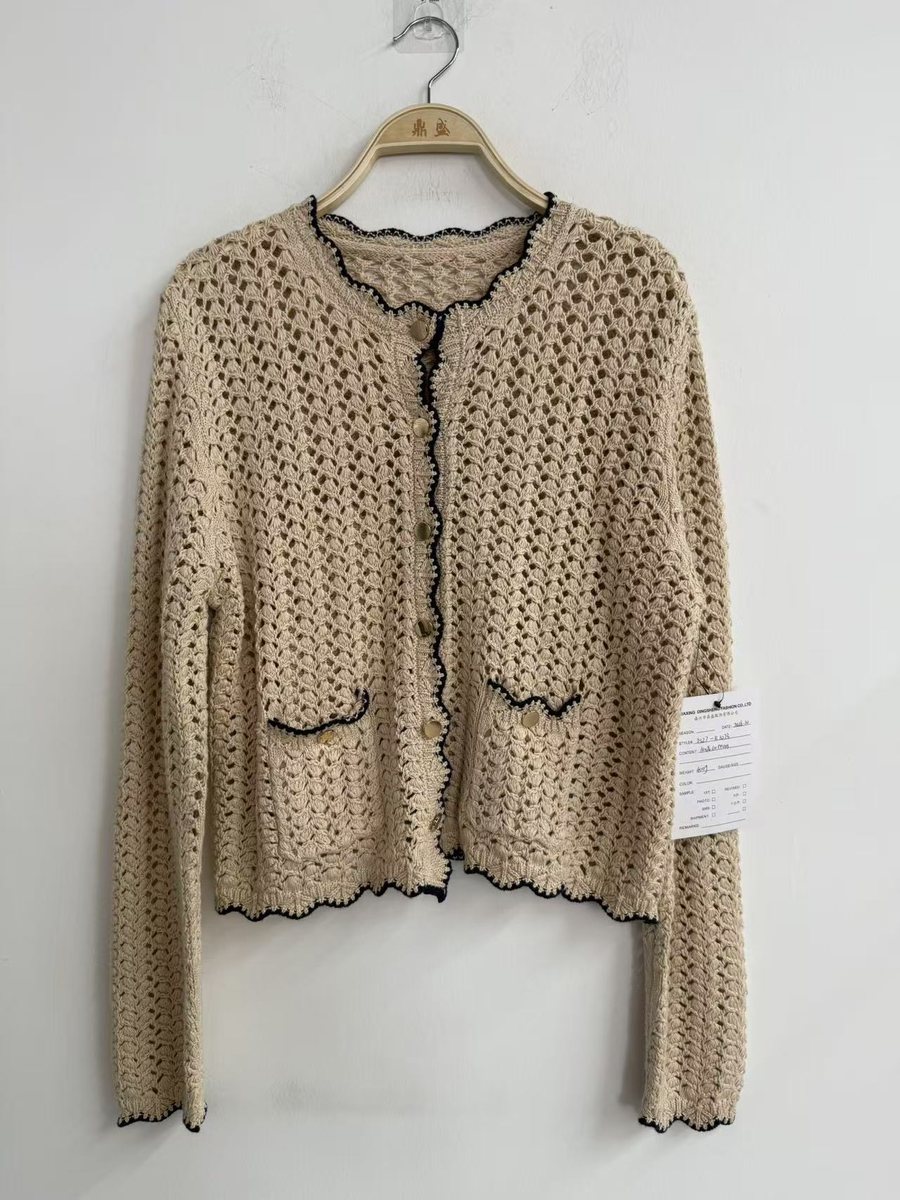 Beige crochet-look cardigan with black scalloped trim, style DS27-K1073, from the Knitwear World sample collection