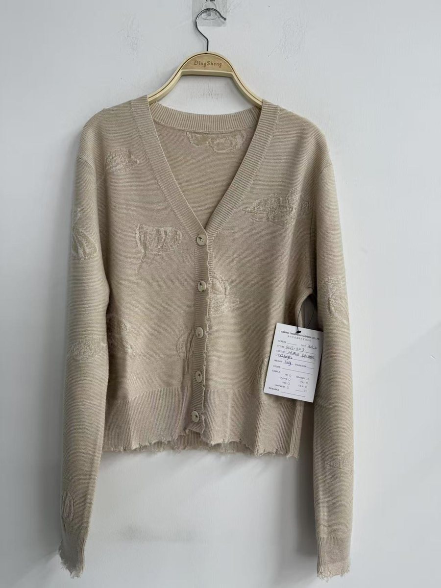 Beige embossed-leaf V-neck cardigan with raw edges, style DS27-K1070, from the Knitwear World sample collection