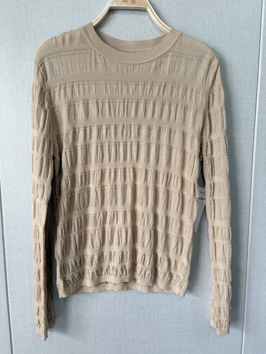 Beige smocked-texture pullover, style DS25-C7009, from the Knitwear World sample collection
