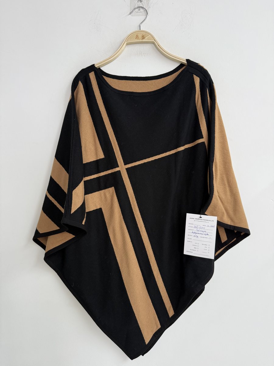 Black and camel colour-block knit poncho, style DS27-K1001, from the Knitwear World sample collection