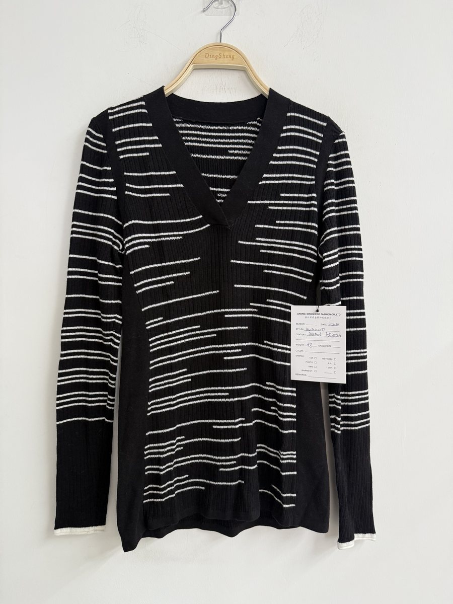 Black and ivory broken-stripe V-neck pullover, style DS27-K1079, from the Knitwear World sample collection