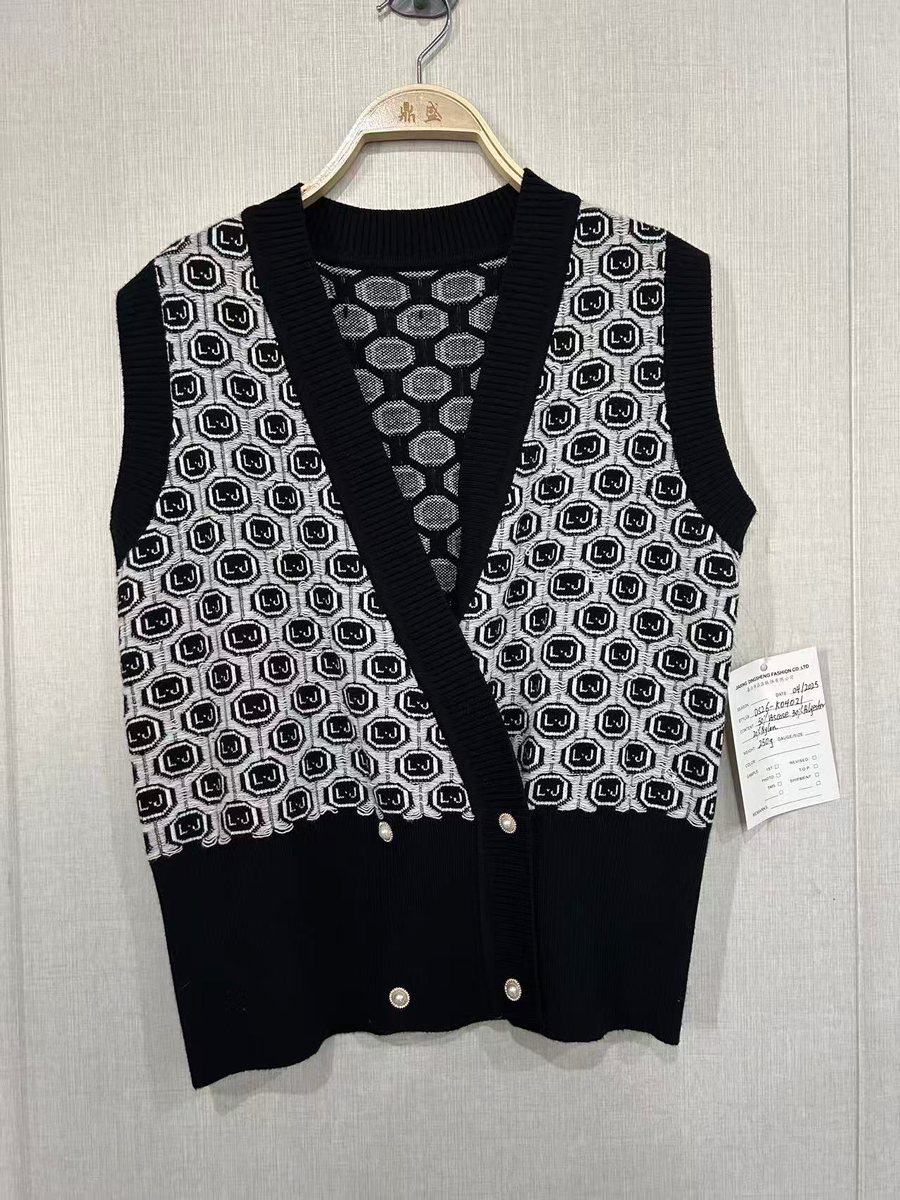 Black and white geometric jacquard double-breasted vest, style DS26-K04021, from the Knitwear World sample collection