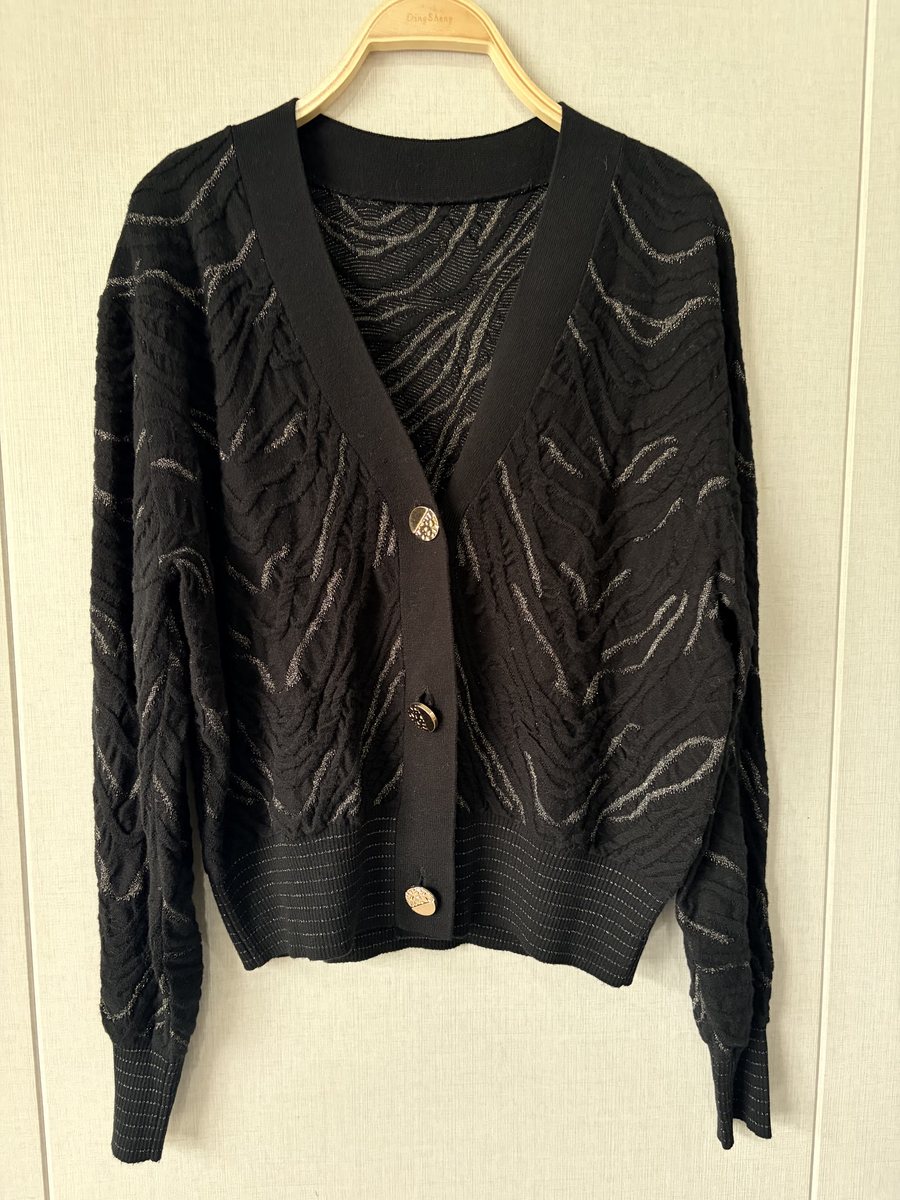 Black cardigan with metallic wave pattern, style DS26-K03006, from the Knitwear World sample collection