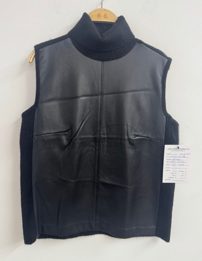 Black mock-neck knit vest with leather-look front, style DS27-K070020, from the Knitwear World sample collection