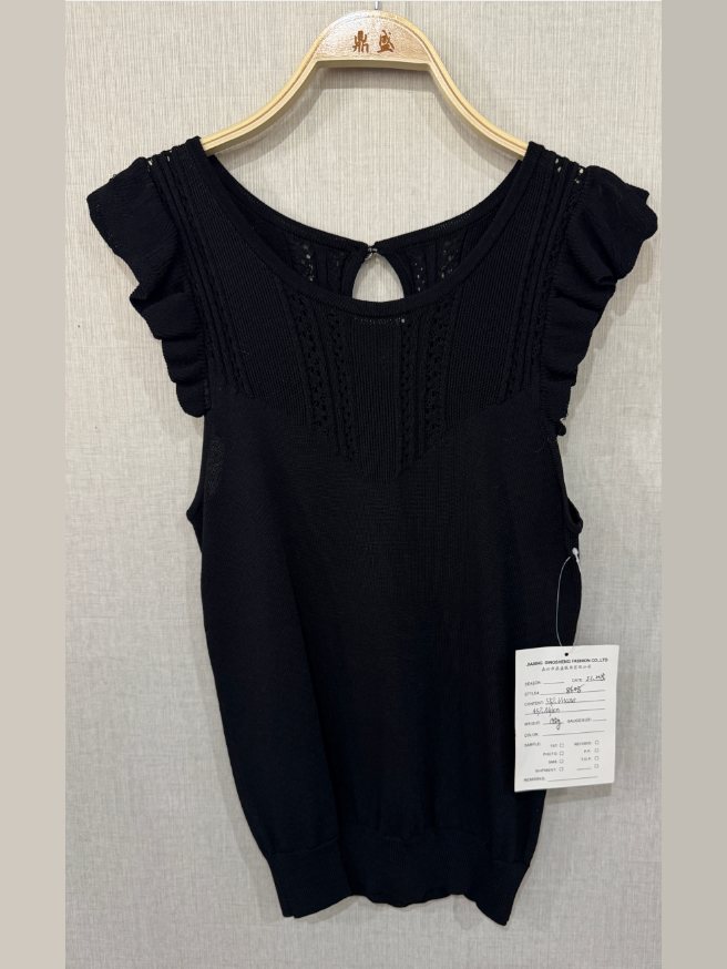 Black pointelle knit top with ruffle sleeves, style 8608, from the Knitwear World sample collection