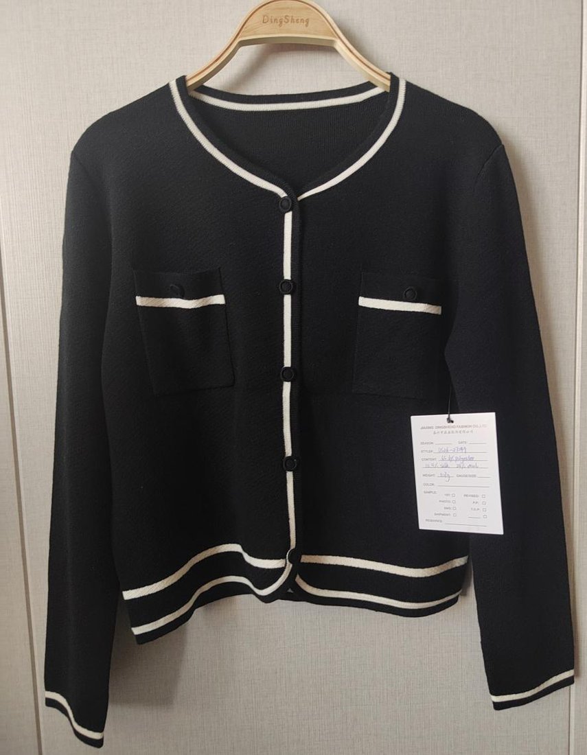Black round-neck cardigan with ivory trim and pockets, style DS26-07049, from the Knitwear World sample collection