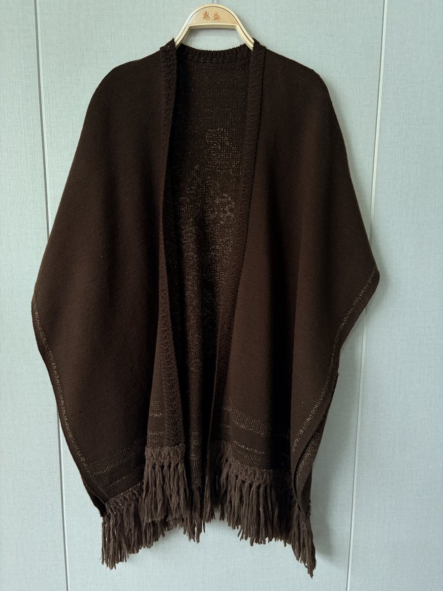 Brown fringed knit poncho, style DS26-K09012, from the Knitwear World sample collection