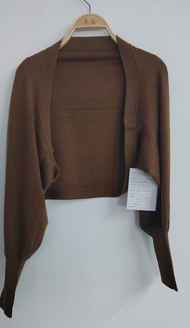 Brown knit shrug, style DS26-08033, from the Knitwear World sample collection