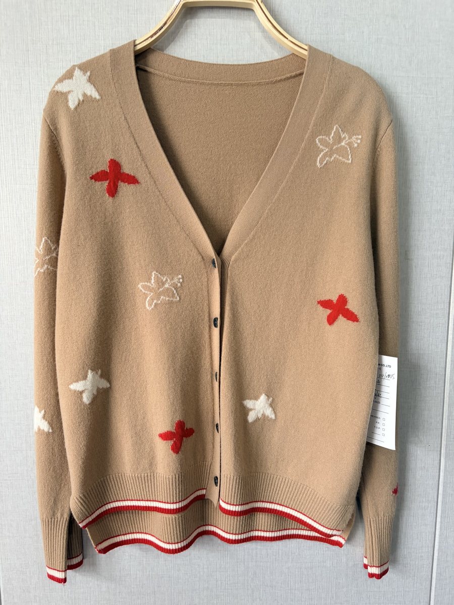 Camel cardigan with star motifs and stripe hem, style DS25-03084, from the Knitwear World sample collection