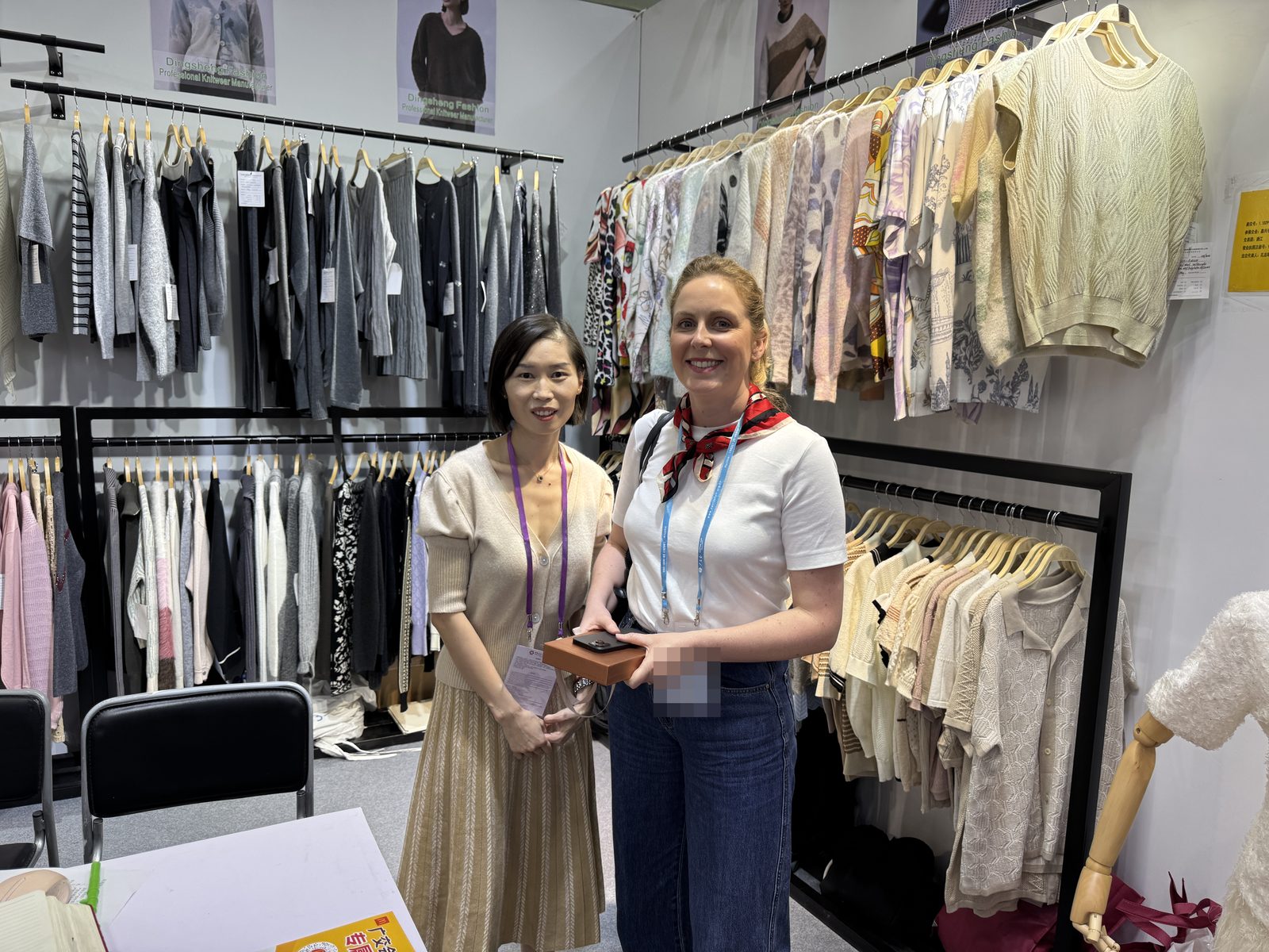 Marcia Lee with a buyer at the Knitwear World stand, Canton Fair, Guangzhou