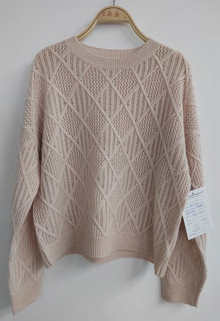 Cream cable and pointelle pullover, style DS26-08003, from the Knitwear World sample collection