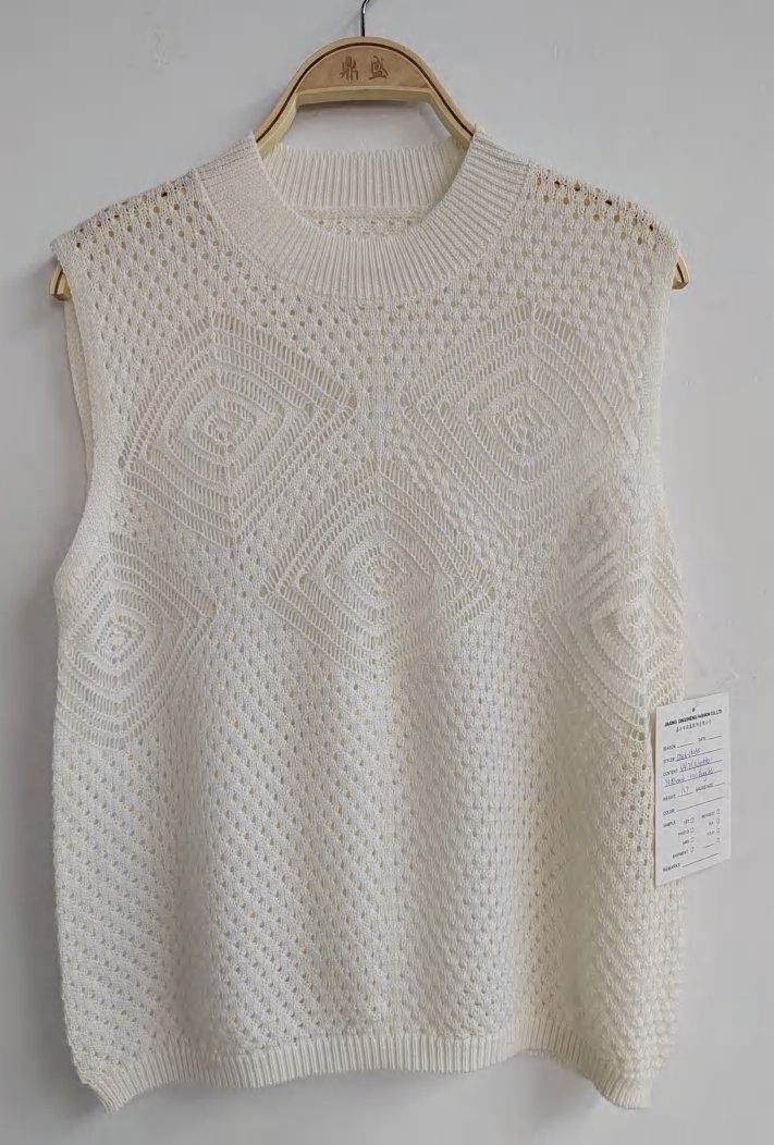 Cream pointelle sleeveless knit top, style DS26-08035, from the Knitwear World sample collection