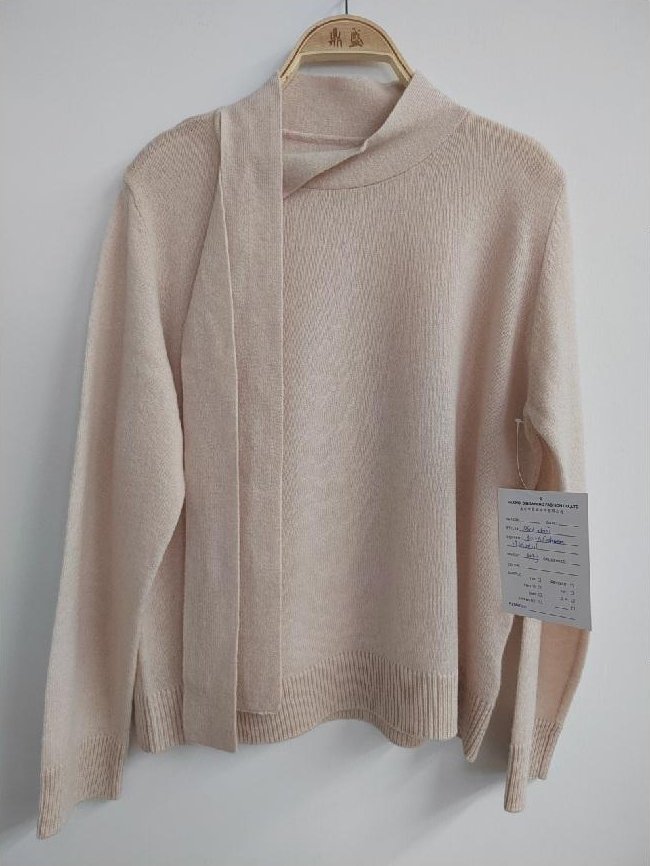 Cream pullover with scarf-tie neckline, style DS26-08007, from the Knitwear World sample collection