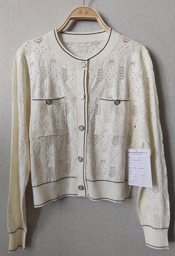 Cream textured cardigan with black trim and pockets, style DS26-07055, from the Knitwear World sample collection