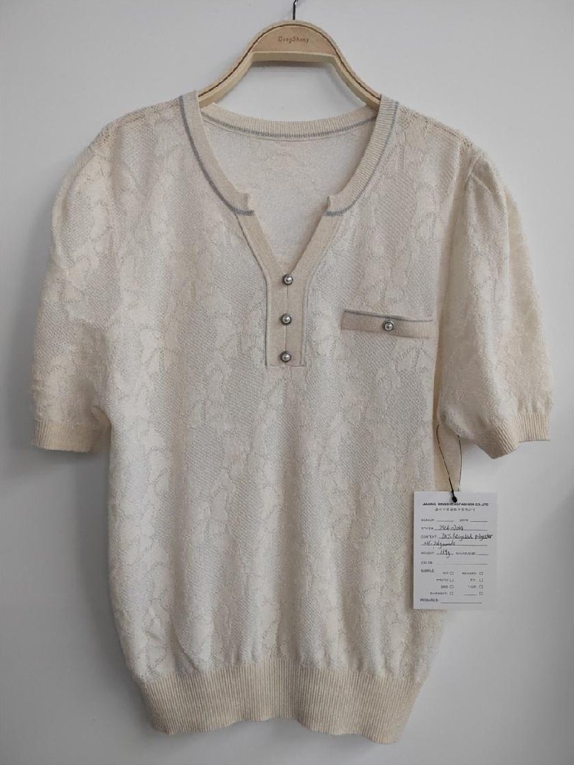 Cream textured short-sleeve top with puff sleeves, style DS26-07034, from the Knitwear World sample collection