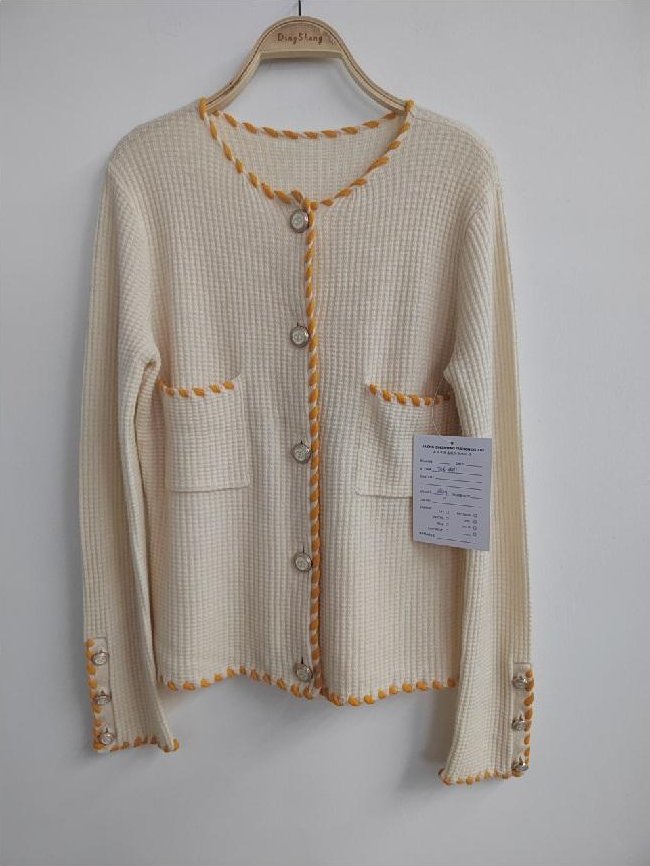 Cream waffle-knit cardigan with contrast trim, style DS26-08011, from the Knitwear World sample collection