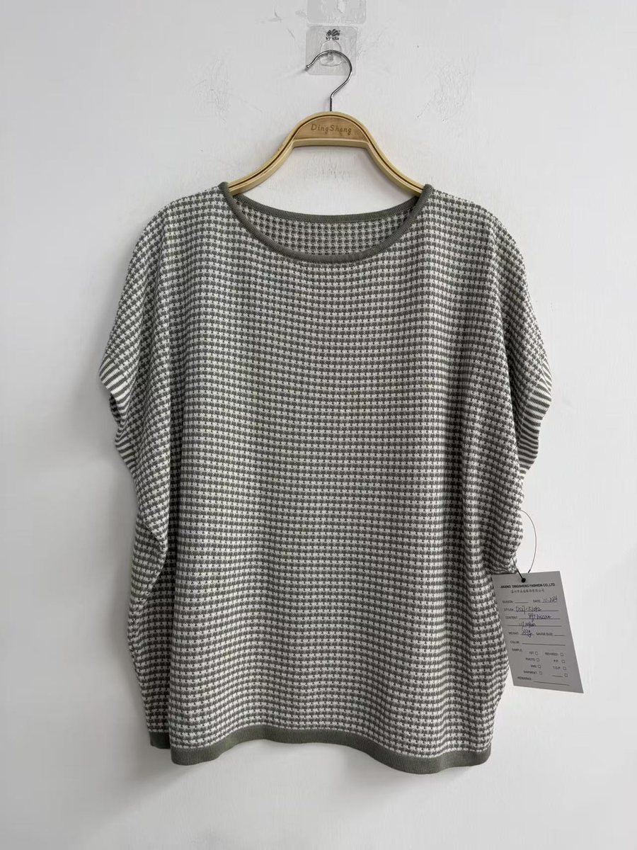 Grey and white check boxy knit top, style DS27-K1042, from the Knitwear World sample collection