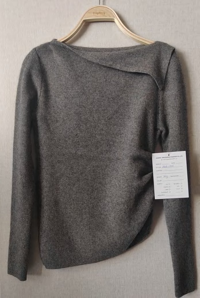 Grey asymmetric-neck pullover, style DS26-07051, from the Knitwear World sample collection