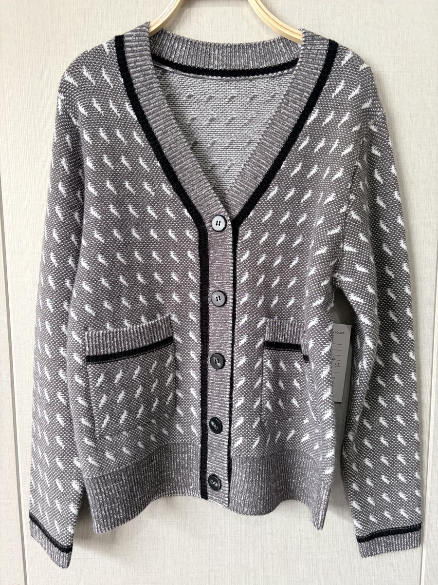 Grey cardigan with dash pattern and black trim, style DS27-K01046, from the Knitwear World sample collection