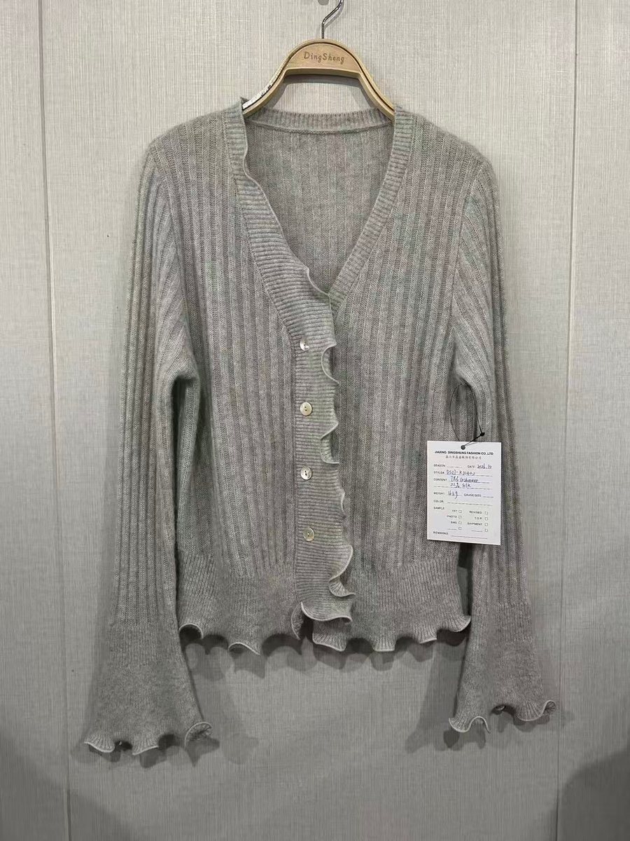 Grey cashmere-silk rib cardigan with ruffle edges, style DS27-K10400, from the Knitwear World sample collection