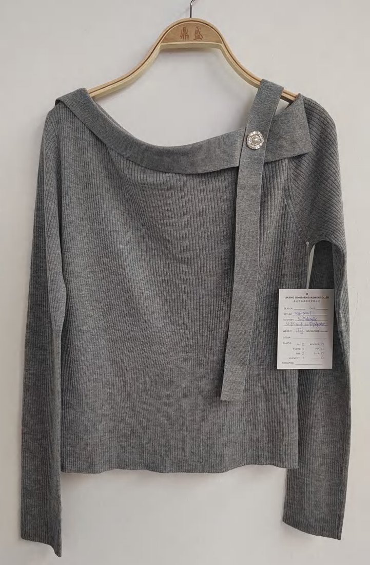 Grey off-shoulder pullover with brooch, style DS26-08027, from the Knitwear World sample collection