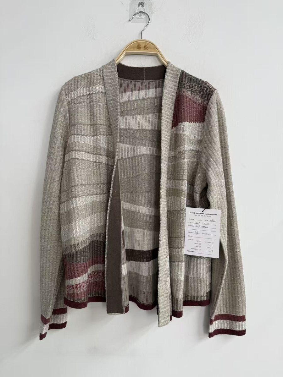 Grey patchwork intarsia cardigan with striped cuffs, style DS27-K1077, from the Knitwear World sample collection