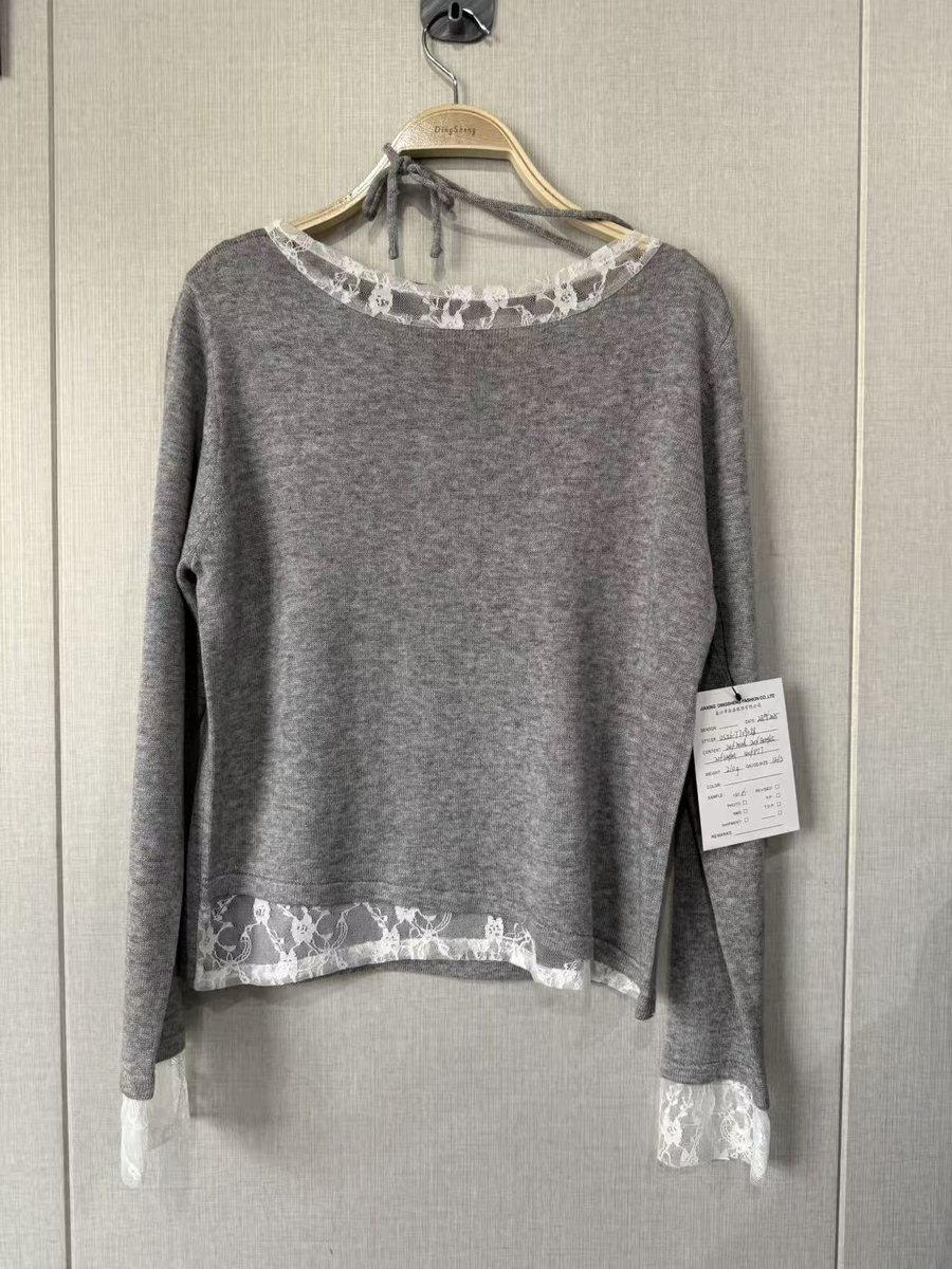 Grey pullover with lace-trim neckline and hem, style DS26-TT09028, from the Knitwear World sample collection