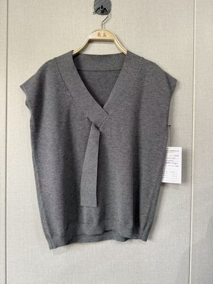 Grey sleeveless V-neck knit top with tab detail, style NS 0227-0364, from the Knitwear World sample collection