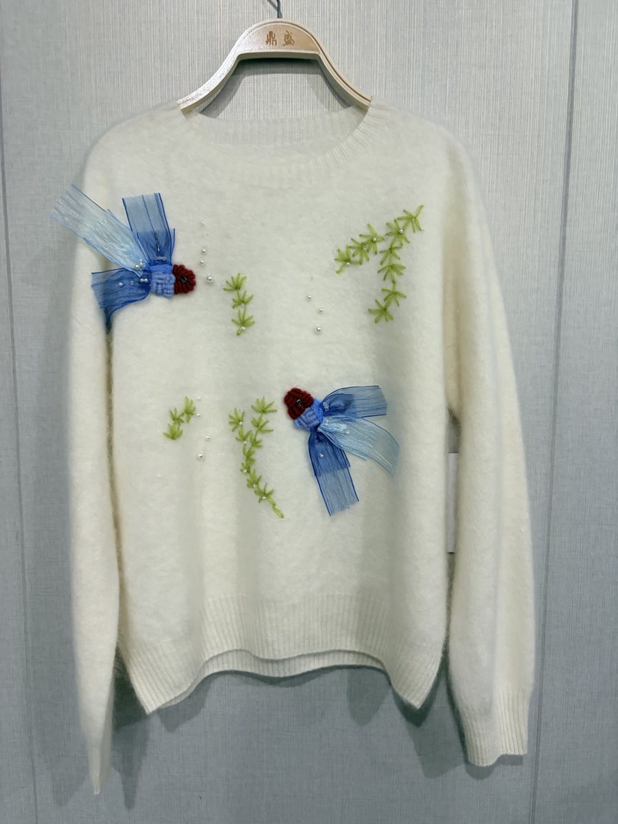 Ivory brushed pullover with embroidery, beads and organza bows, style DS27-B07019, from the Knitwear World sample collection