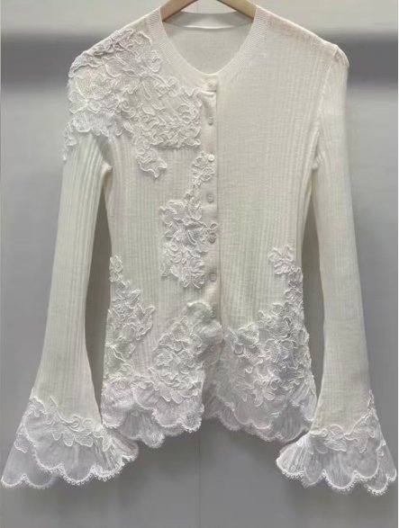 Ivory cardigan with lace appliqué and bell cuffs, style DS27-VE024, from the Knitwear World sample collection