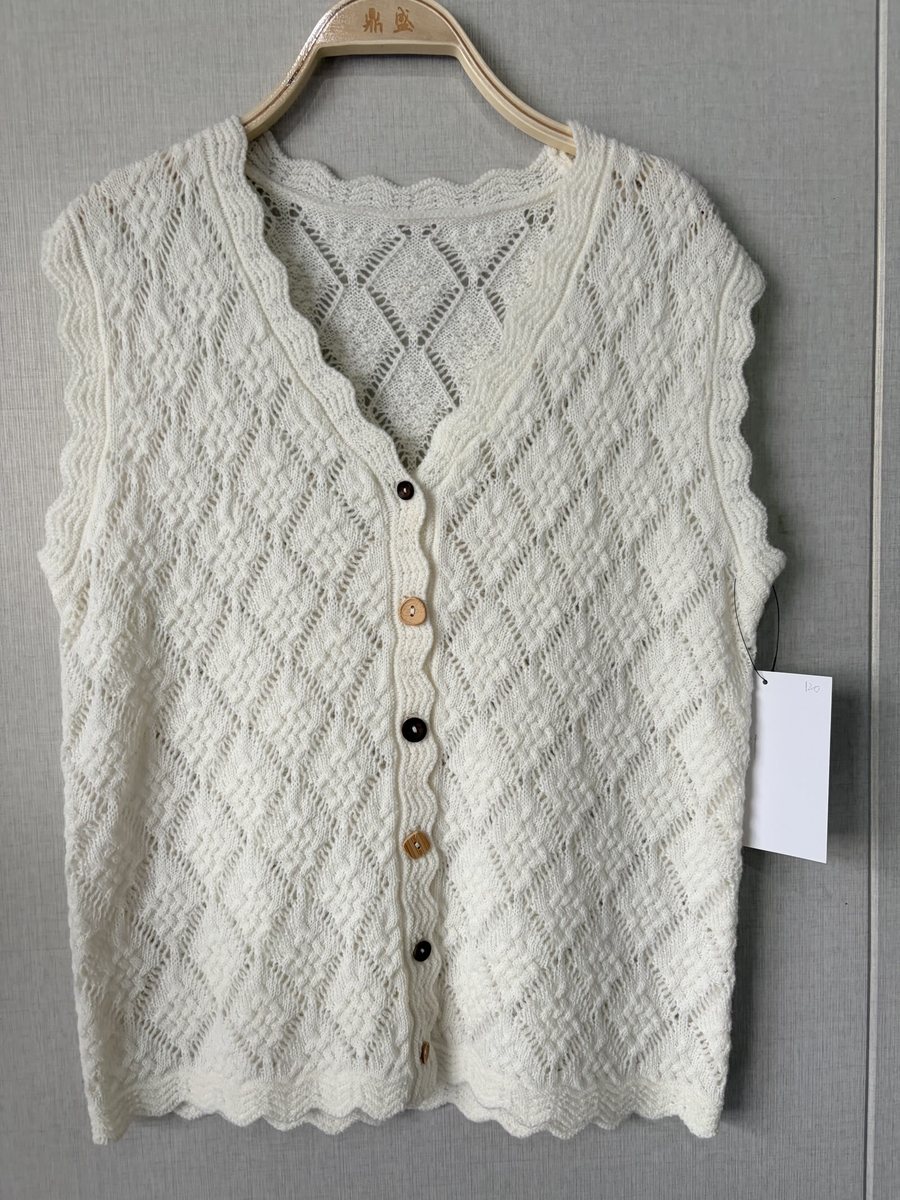 Ivory diamond-pointelle vest with scallop trim, style DS27-K06045, from the Knitwear World sample collection