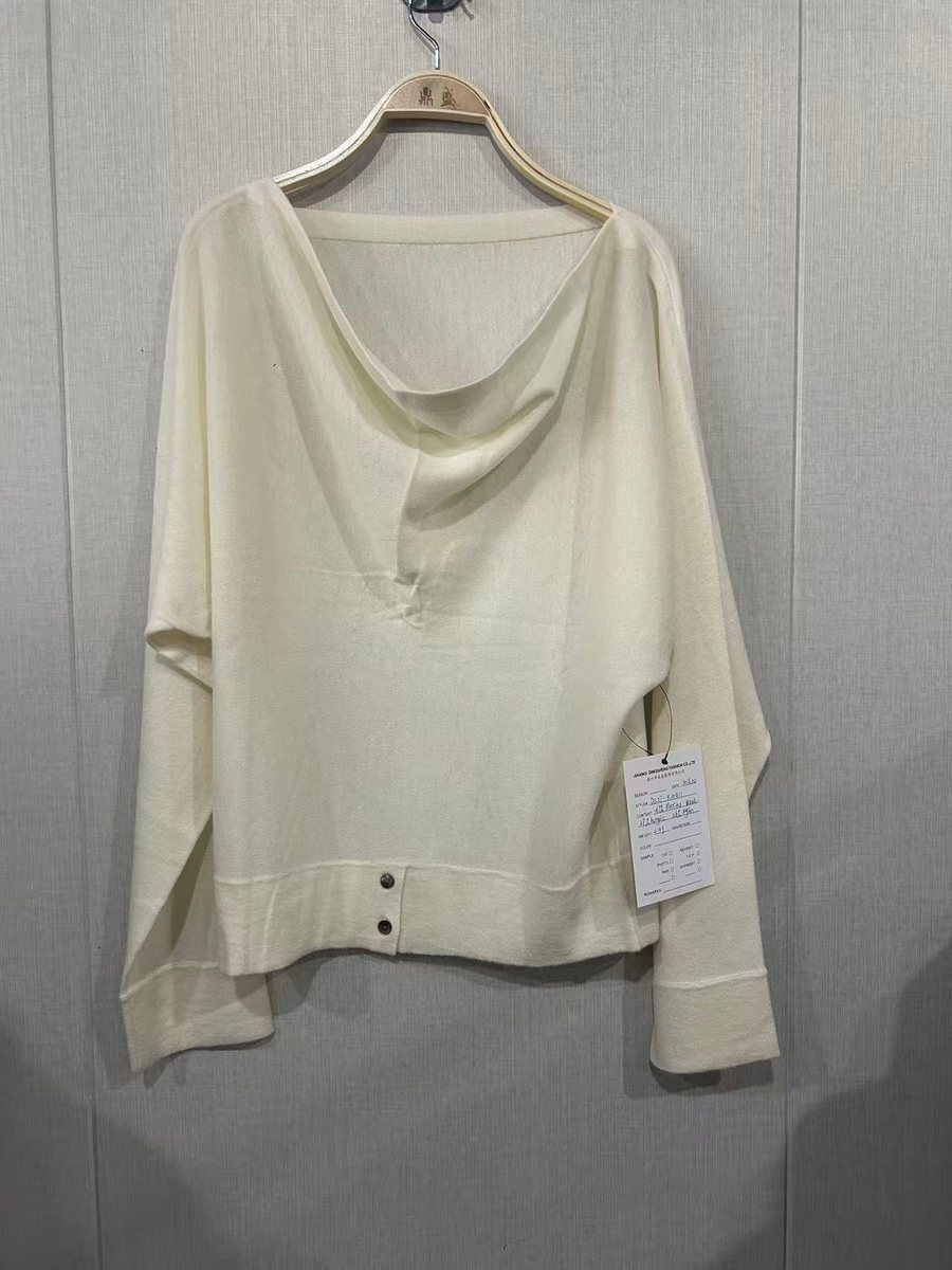 Ivory merino draped off-shoulder top, style DS27-K10401, from the Knitwear World sample collection