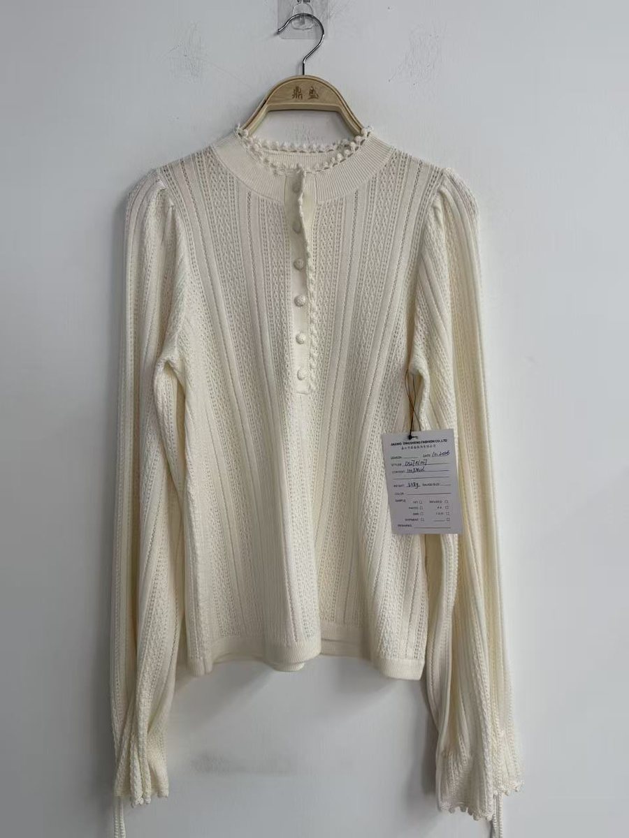Ivory pointelle-rib henley pullover with puff sleeves, style DS27-K1007, from the Knitwear World sample collection