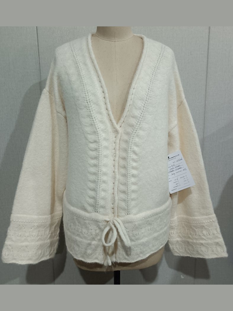 Ivory pointelle V-neck cardigan with drawstring hem, style DS27-09040, from the Knitwear World sample collection
