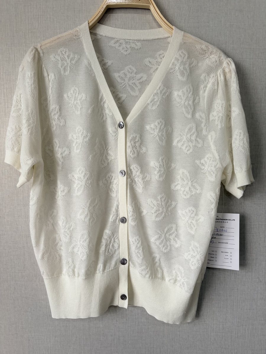Ivory short-sleeve cardigan with butterfly pointelle, style DS27-YS04011, from the Knitwear World sample collection