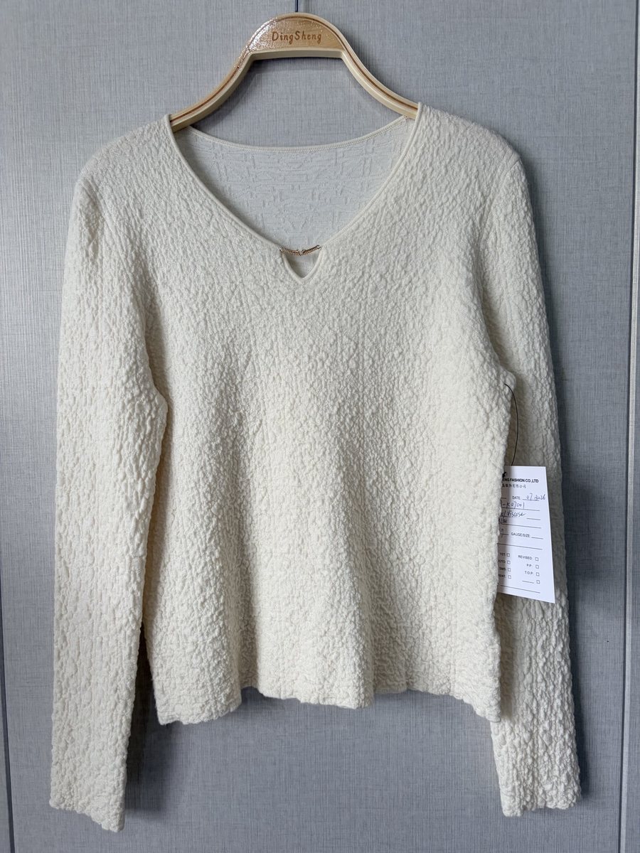 Ivory textured V-neck pullover, style DS27-K07001, from the Knitwear World sample collection