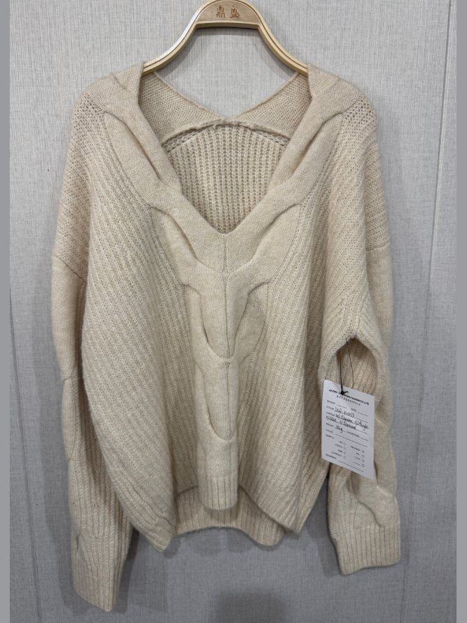 Ivory twisted-front V-neck pullover, style DS27-K04075, from the Knitwear World sample collection