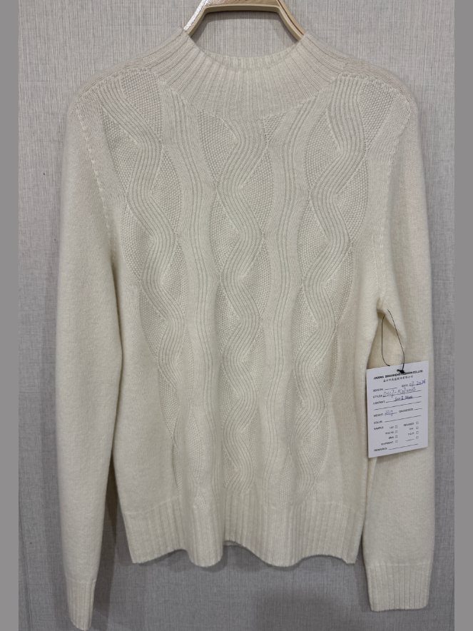 Ivory wave-cable mock-neck pullover, style DS27-K07013, from the Knitwear World sample collection