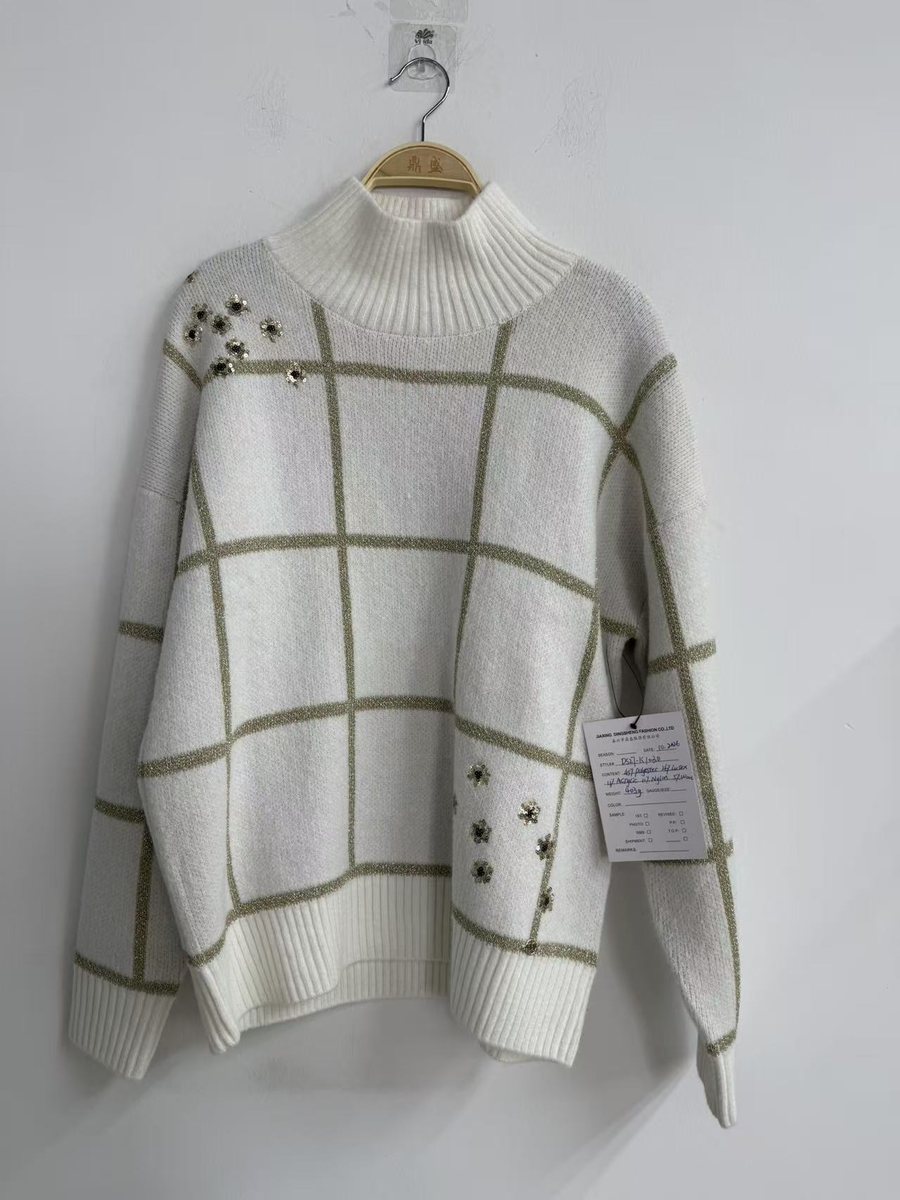 Ivory windowpane-check mock-neck pullover with star embellishment, style DS27-K1030, from the Knitwear World sample collection