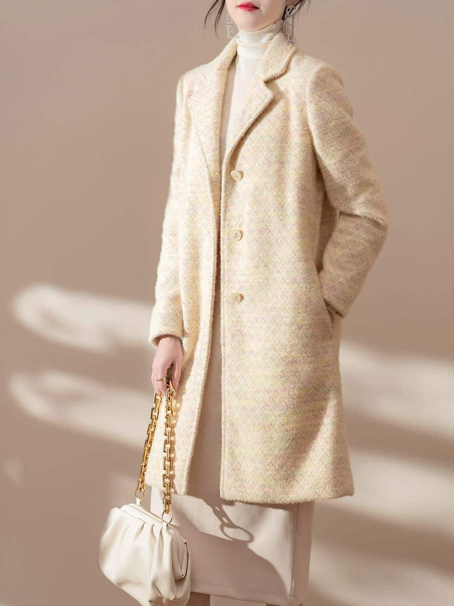Women's knit coat in butter yellow tweed knit, made by Knitwear World