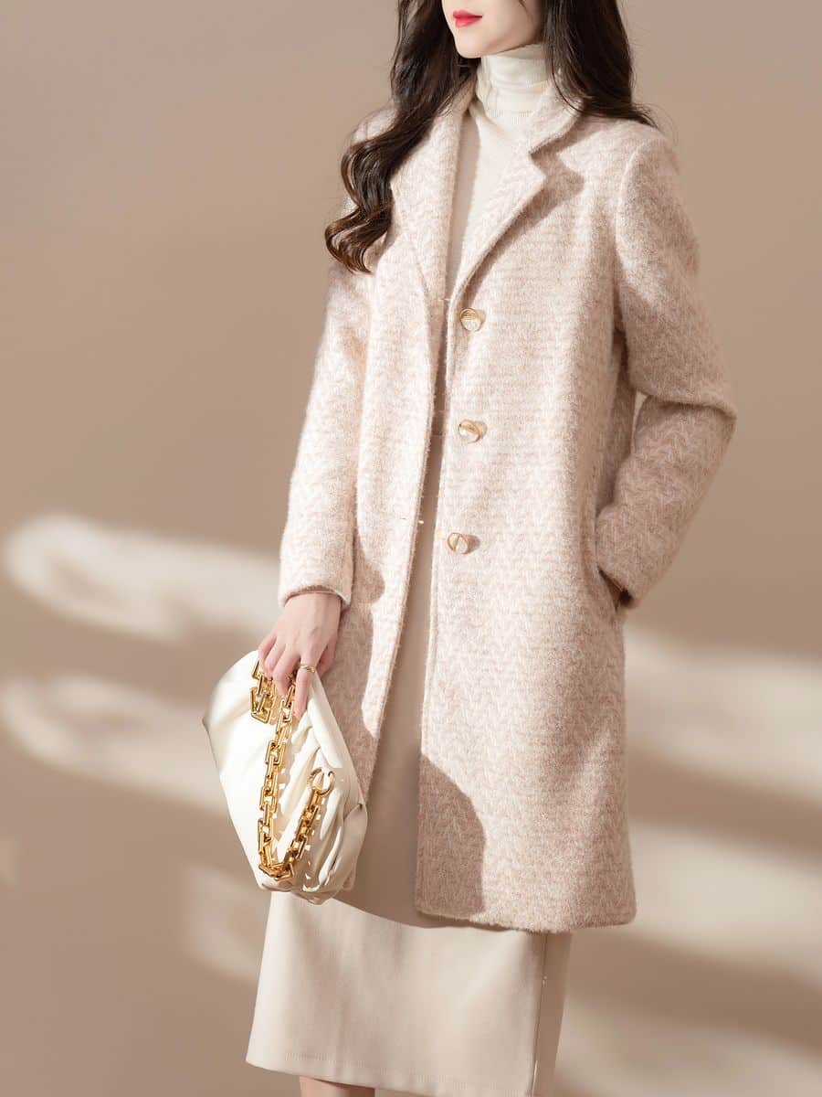 Women's knit coat in cream, made by Knitwear World