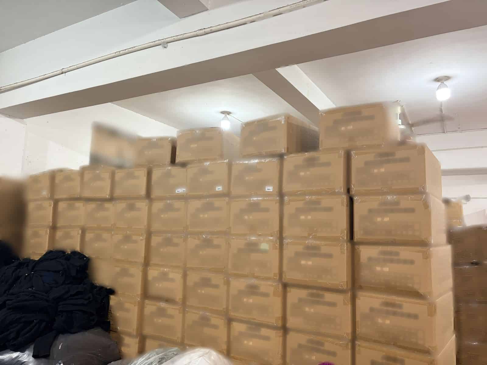 Finished goods warehouse at Knitwear World with packed cartons of sweaters ready to ship