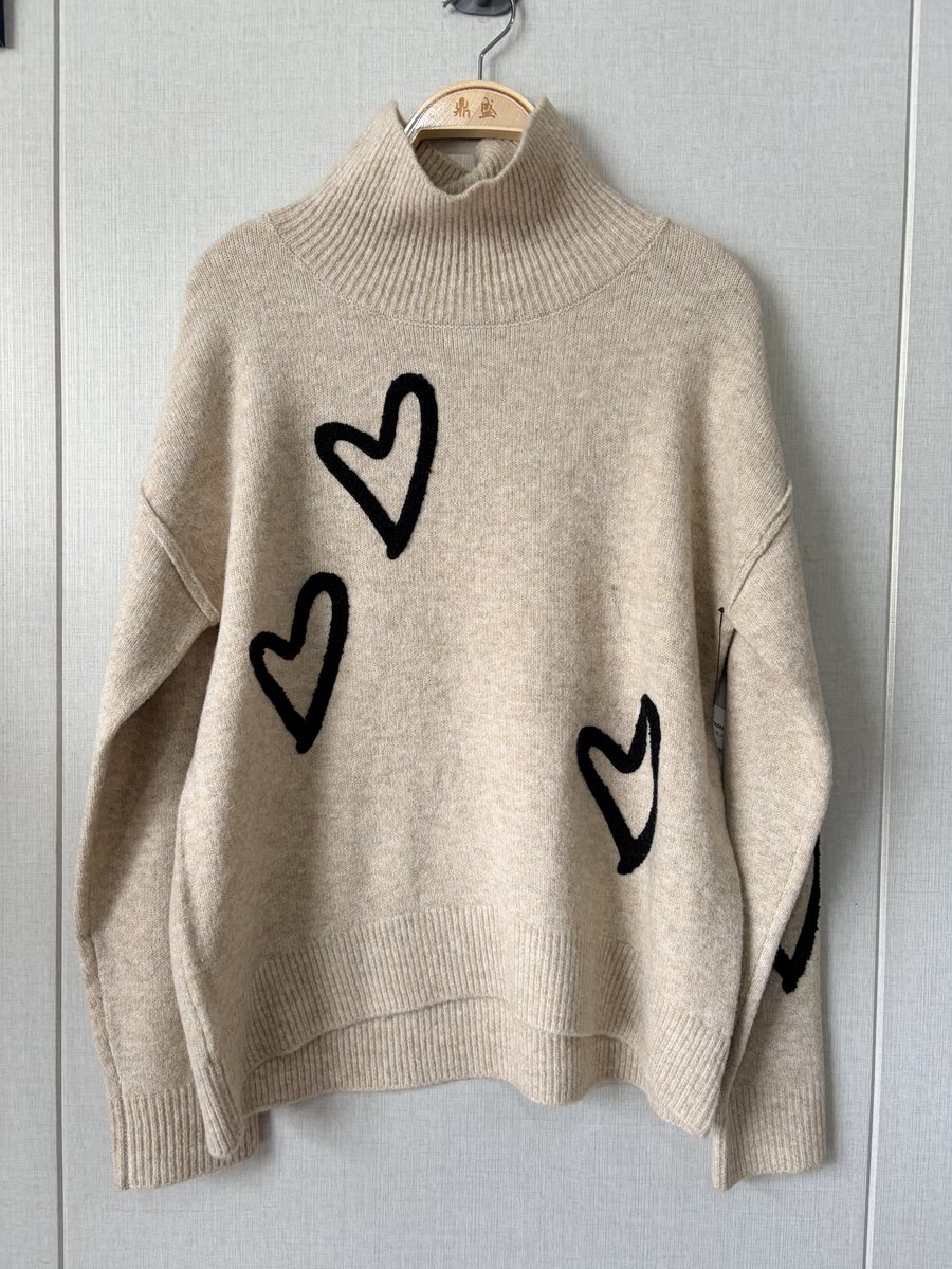 Oatmeal mock-neck pullover with heart motifs, style CT2410001, from the Knitwear World sample collection