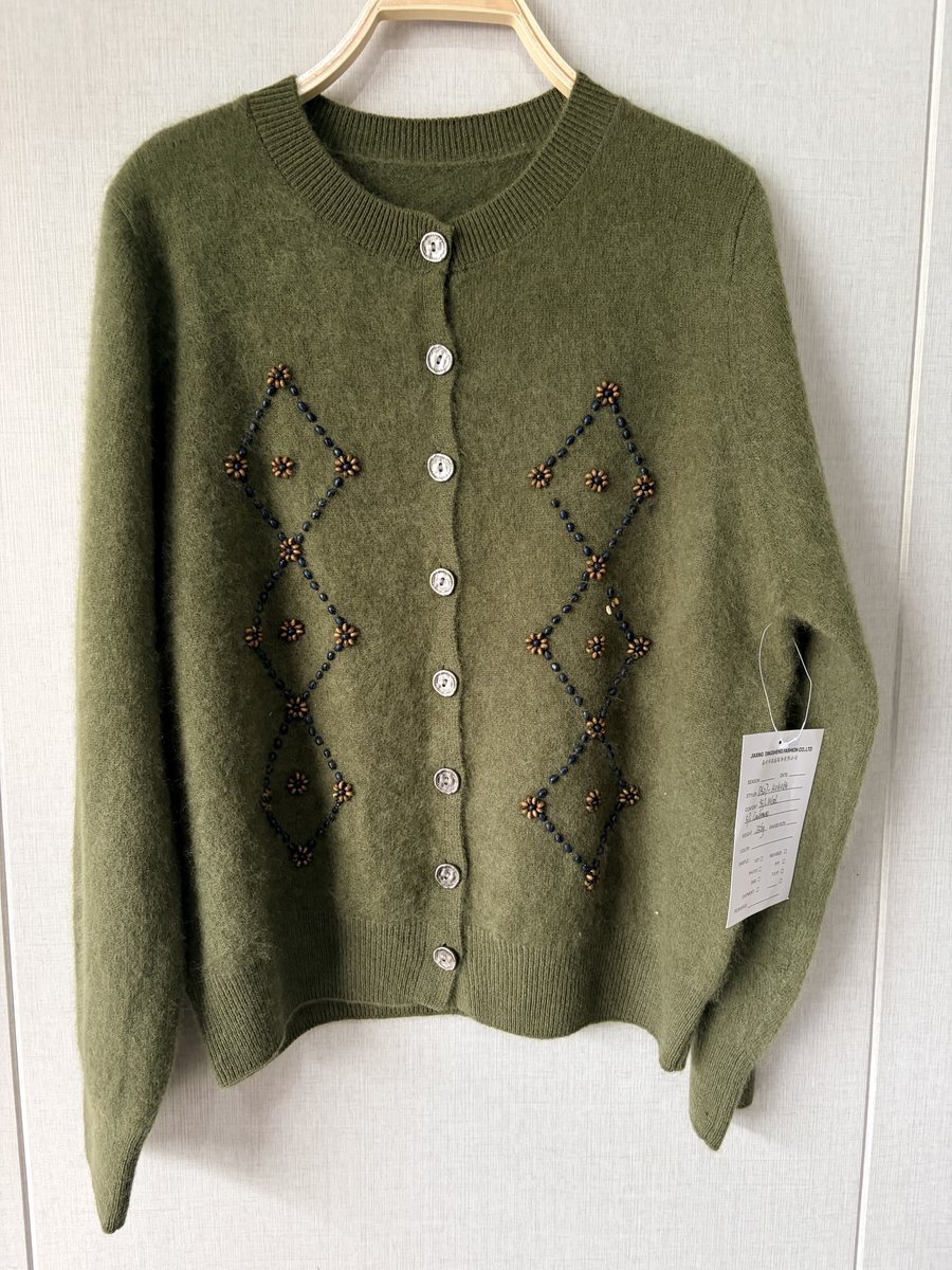 Olive cardigan with beaded diamond motifs, style DS27-K04064, from the Knitwear World sample collection