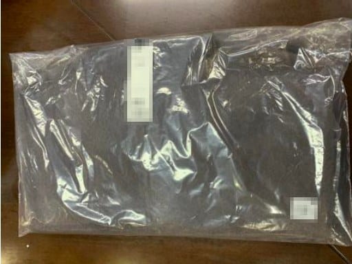 Ironed, labelled and polybagged sweater ready for shipment