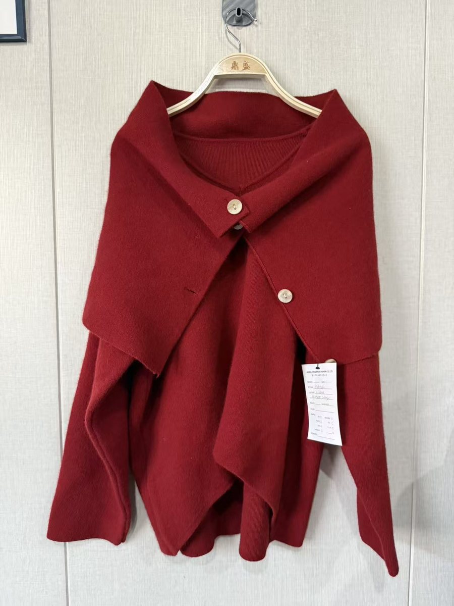 Red cape-collar knit jacket with asymmetric buttons, style DS26-AK1105, from the Knitwear World sample collection