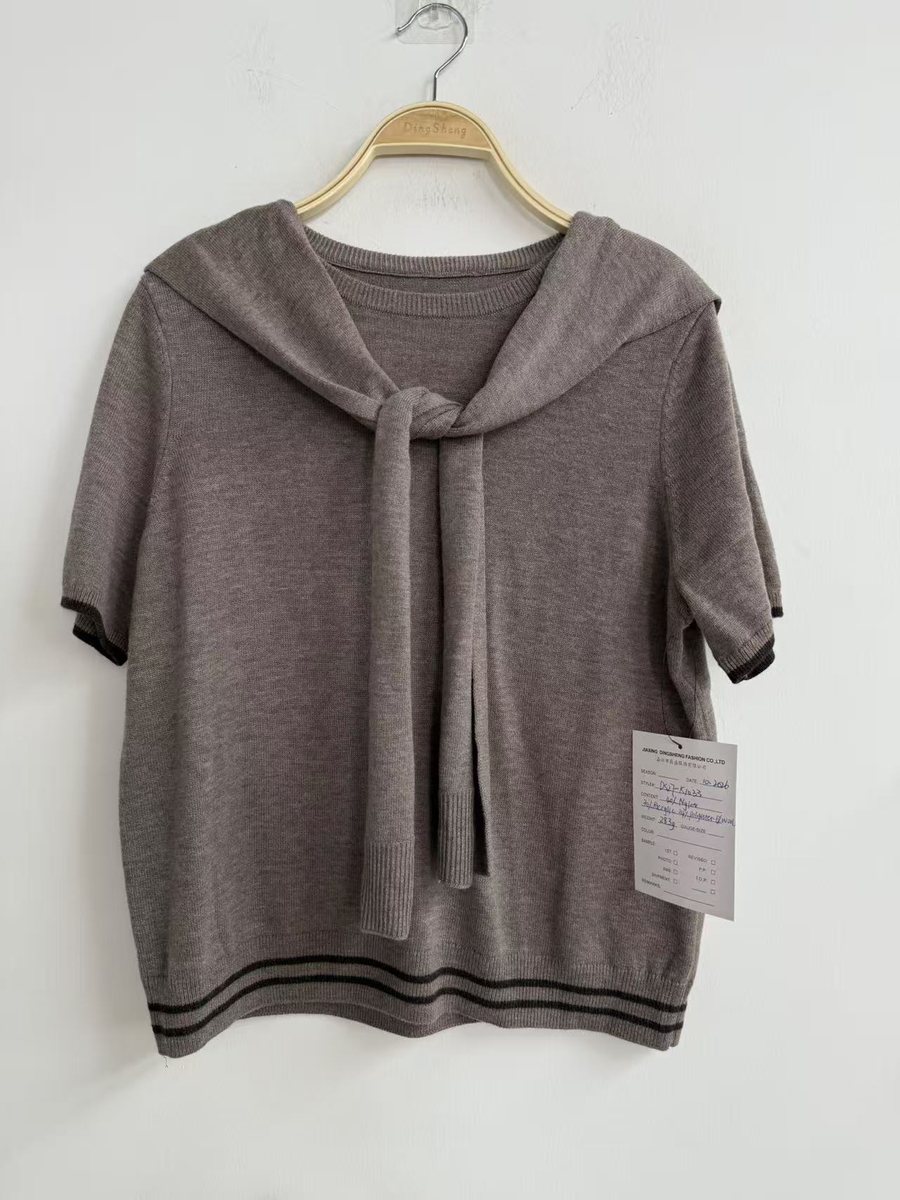 Taupe short-sleeve knit top with tie collar and tipped hem, style DS27-K1033, from the Knitwear World sample collection
