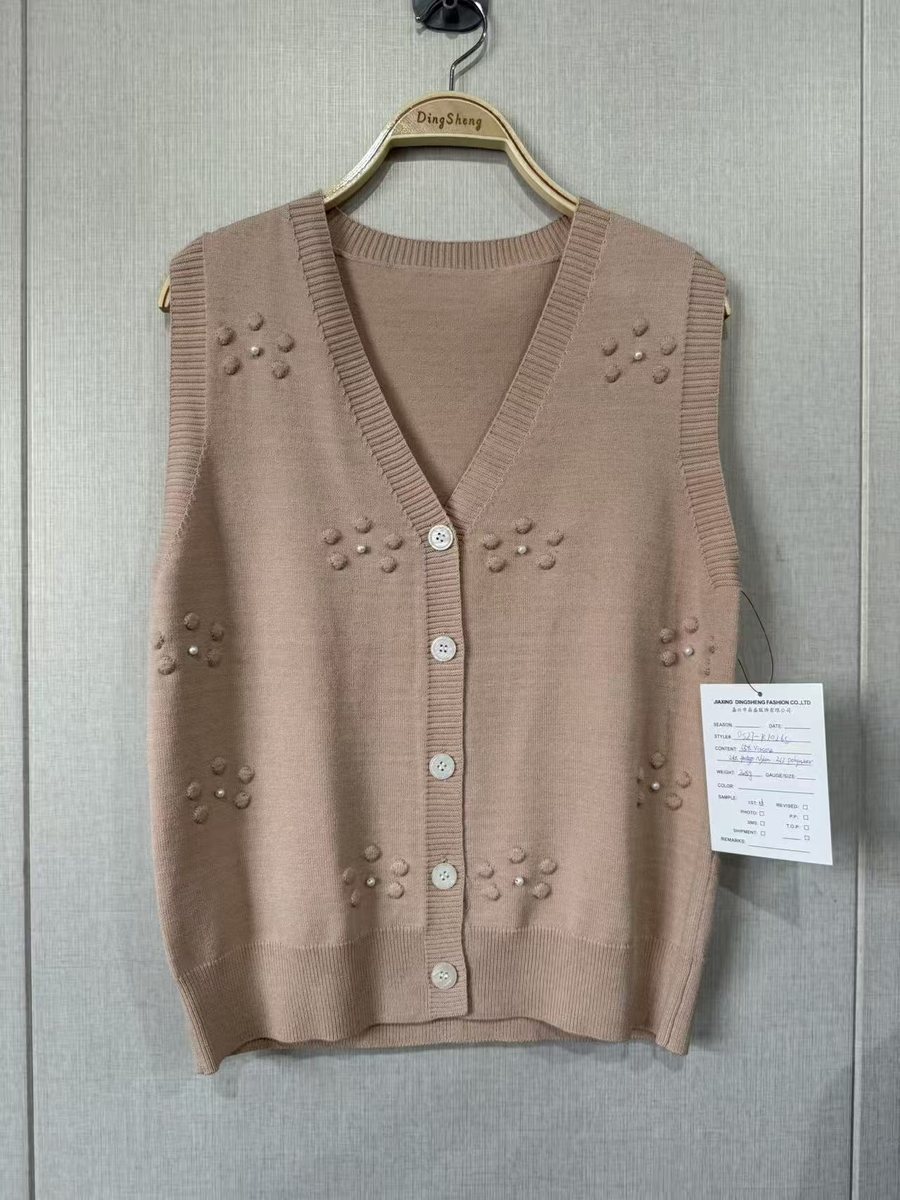 Taupe V-neck sweater vest with pearl clusters, style DS27-K10265, from the Knitwear World sample collection